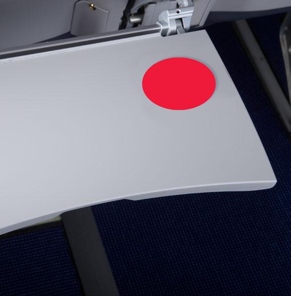 Advertisement sticker placed on tray tables in