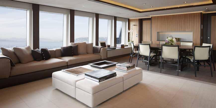 The open plan main deck lounge [11] offers great views even when seated on the large sofa or at the casual dining