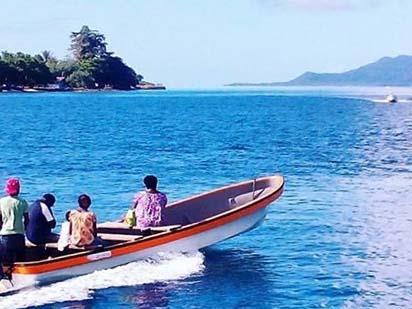 skiff) owned by Madang Resort for a sightseeing and snorkelling excursion.