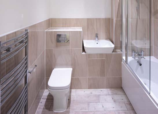 Porcelanosa white sanitary ware with shower over bath Porcelanosa walk in shower to en-suite Full height ceramic tiling around bath and shower area, half height tiling to remainder Ceramic Tiling to
