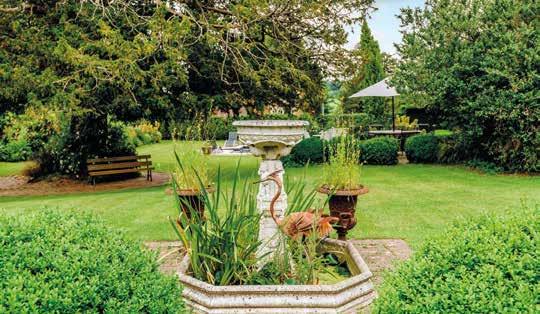 The gardens are entirely to the rear of the property and comprise a pretty formal parterre of gravel and clipped box from where attractively weathered brick paths lead between