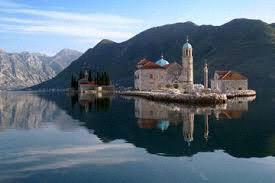 The Gulf of Kotor (Boka Kotorska) cuts deeply into the coastline of the southern part of the Yugoslav Adriatic, creating four spectacular bays ringed in mountains, the fjords of the Mediterranean.