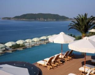 with deck-chairs and sun umbrellas, situated 200 m away from the hotel