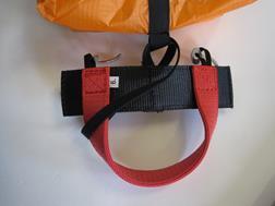 near the padded shoulder straps. In this case, the harness bridle is not needed and should be folded up, fastened using two rubber bands and then stored away under the cover behind the pilot s neck.