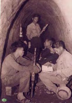 I learned of one tunnel, 1,700 meters long, that was started in 1958 and required two and one-half years for completion by a force of 100 workers.