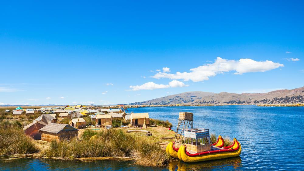 Lake Titicaca Uros & Taquile DAY 8 Floating high in the Andes Mountains and forming a natural border between Peru and Bolivia, Lake Titicaca is one of the most remarkable sights in all of South
