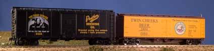 colorful HO scale billboard boxcars to