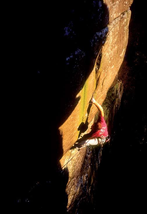 The grand finale is the hanging flake to the left; gaining this is awkward and climbing it intimidating, so just as well the gear is so good: photo on page 354.
