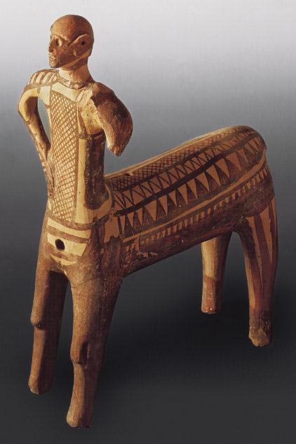 Title: Centaur Medium: Ceramic Size: height 14 ⅛" (36 cm) Date: Late 10th century BCE GEOMETRIC PERIOD- Named because of the geometric patterns associated with it Cross