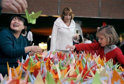 AP/AFLO REUTERS/AFLO At a culture center in Bilbao, Spain, people help to fold 1,000 paper cranes in support of the earthquake disaster victims in Japan,