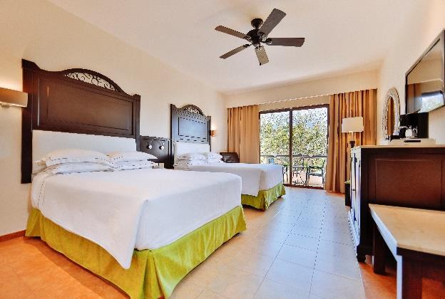 ROOMS CATEGORIES Deluxe Room Surrounded by beautiful gardens our deluxe rooms are spacious and offer a terrace or balcony.