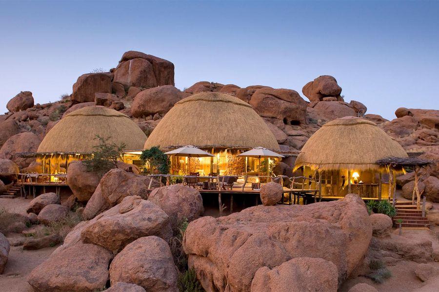 ACCOMMODATION DAMARALAND CAMP KIPWE Nestled between vast granite boulders and looking down the Aba Huab Valley, Camp Kipwe is one of the most dramatically situated camps in all of Namibia, which,