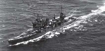 Astoria in July 1942 off Hawaii, before deploying to the South Pacific. The ship is in its early war configuration. It has assumed the Ms 21 dark gray scheme. Several 20mm single and four 1.