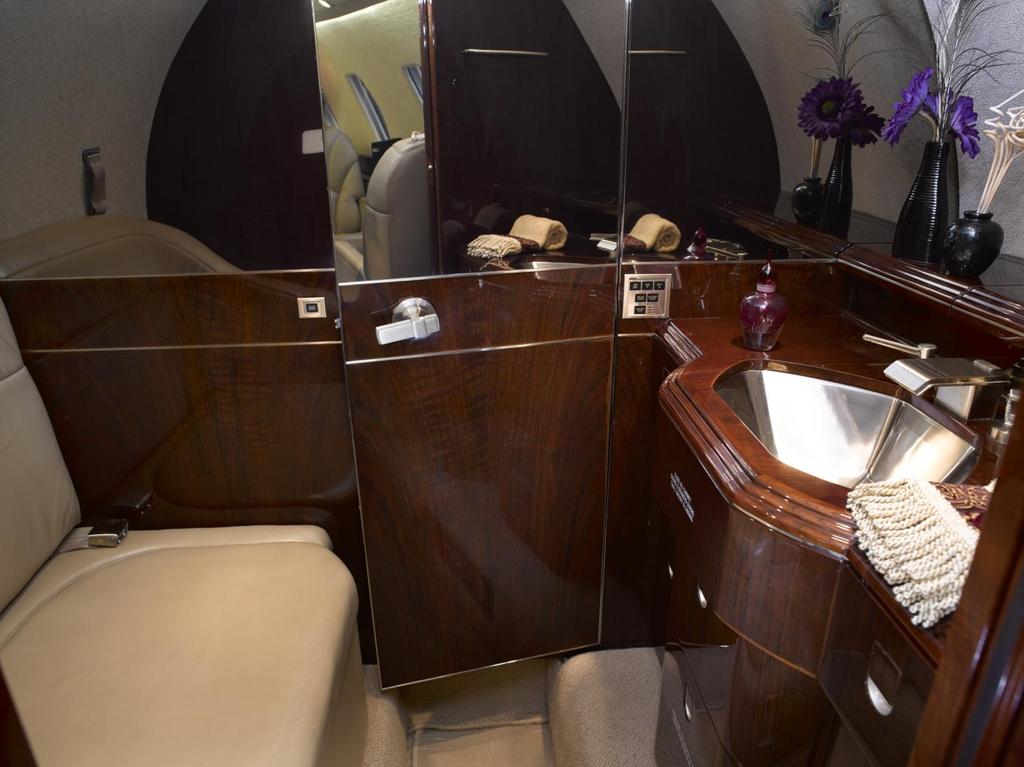 The Citation X s aft lavatory with solid door and large