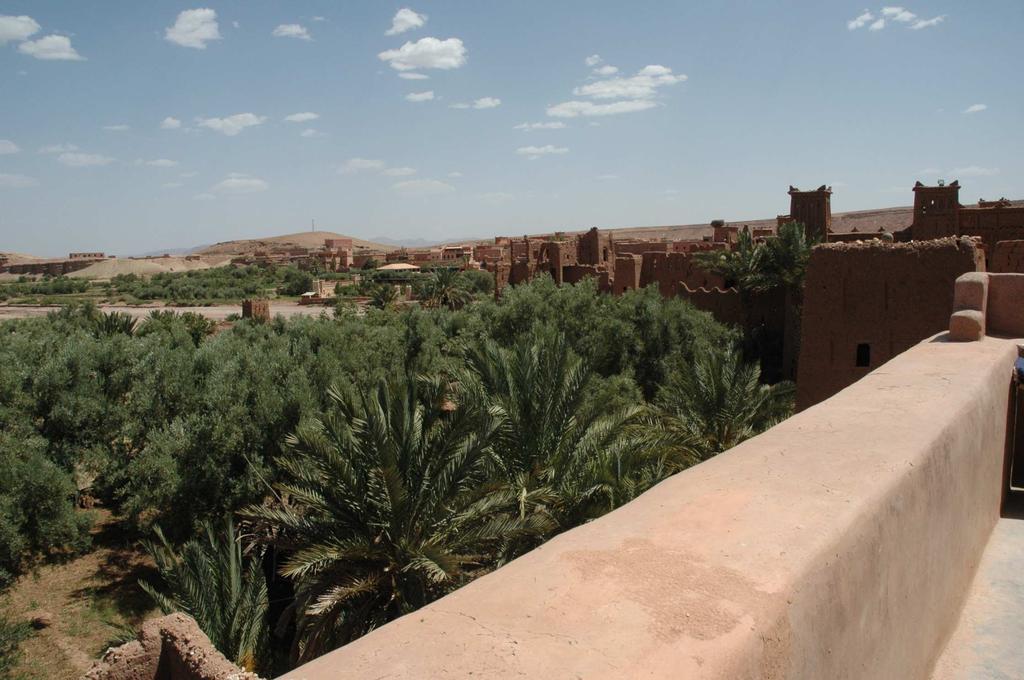 Two kilometers before the entrance of the village, a promontory along the road offers a panoramic view of the whole ksar and vegetables along Ouarzazate river.