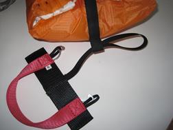 Fig. 5: Fitting the deployment handle Inserting the reserve First, place the correctly packed reserve next to the harness the way