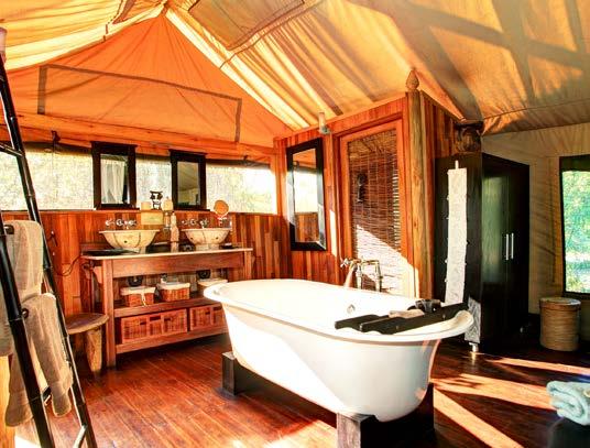 mosquito net, en-suite facilities with indoor and outdoor showers, and gas tea/coffee making