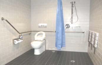 Sufficient space under wash basin required for a person in a wheelchair to access.