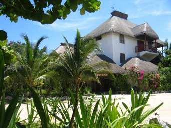 The upper level rooms have exposed thatched roof ceilings and a better sea view, while the beach level rooms are