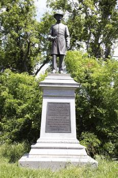 Head across the mowed area up to Confederate Avenue and cross over to the General Tilghman statue.