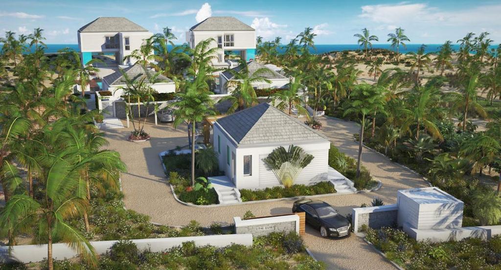The Dunes Villas - Gated Entrance, Lush Landscaping, Resort Amenities With construction on schedule, the first villa along with the shared fitness center / service building, plus the gated entrance,