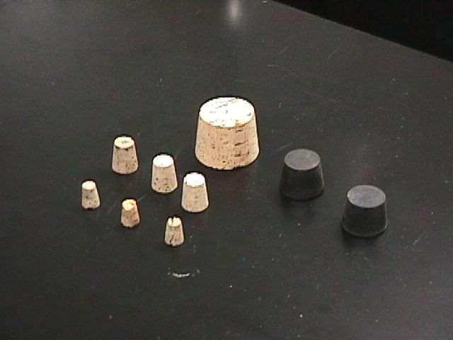 Stopper Rubber and cork stoppers are used to close test tubes and flasks, thus avoiding spillage or contamination.