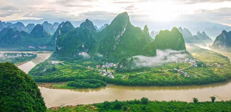 Next morning enjoy a scenic cruise along the stunning Li River to the cobblestone town of Yangshuo. Spend the rest of your day at leisure to enjoy the charms of the town and its lovely surroundings.