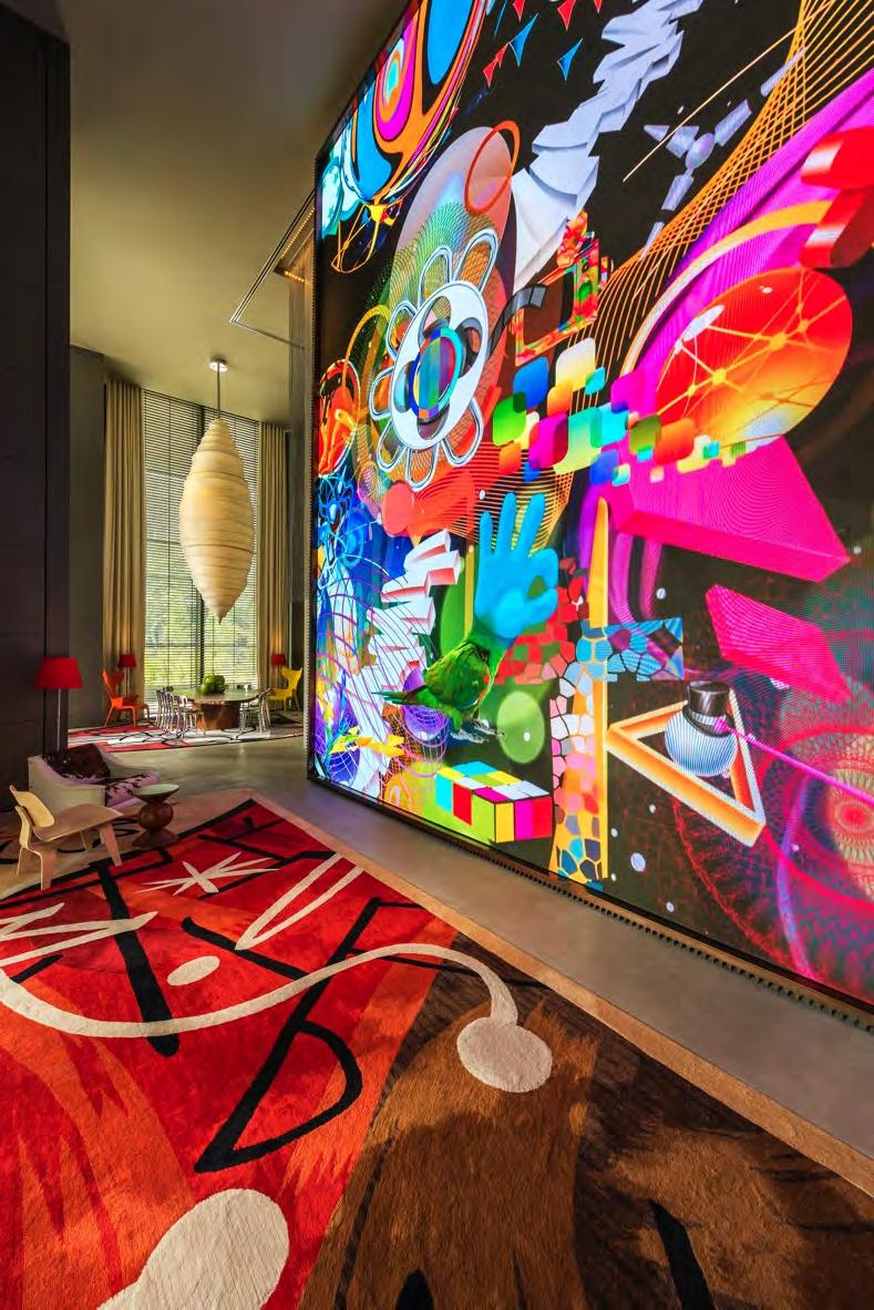 The entrance to the hotel is dominated by a massive, floor-to-ceiling art installation by digital artist