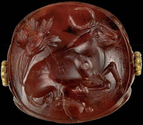 Carnelian seal stone of a bull and lion