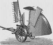 The mechanical reaper developed by Cyrus McCormick which sped up