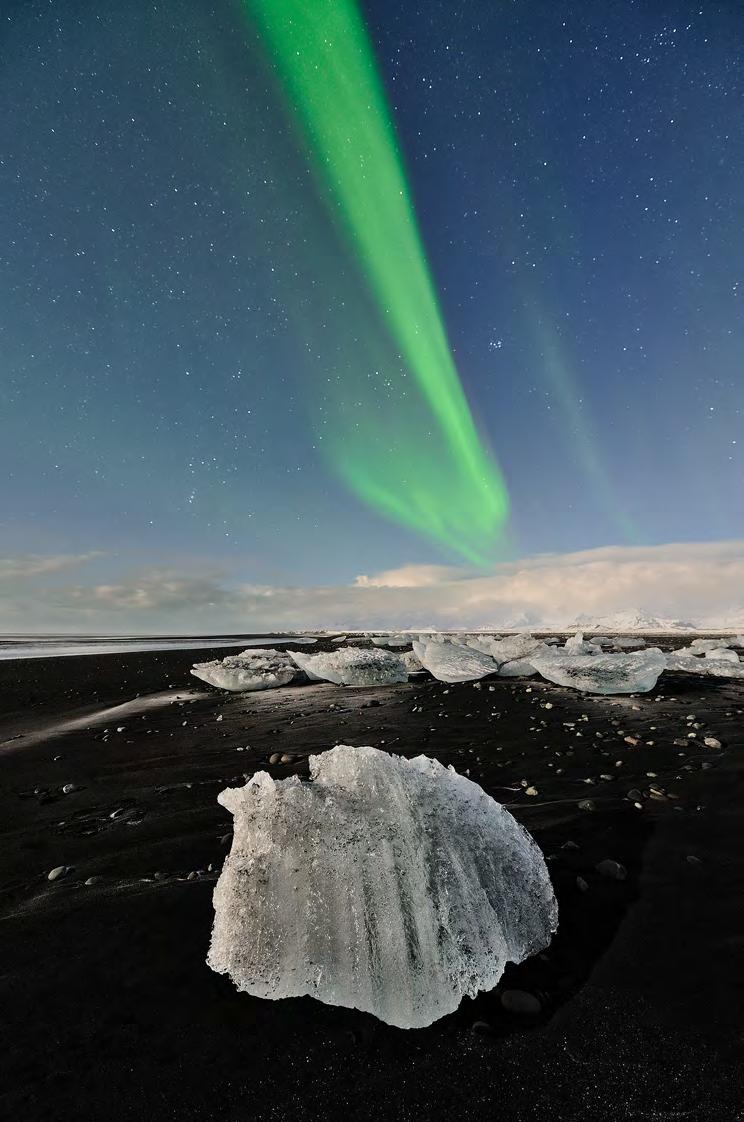 PART TWO: THE SOUTH-EAST Northern Lights over a black lava beach in the South-East of Iceland. The South-East of Iceland is all about glaciers, black beaches and icebergs.