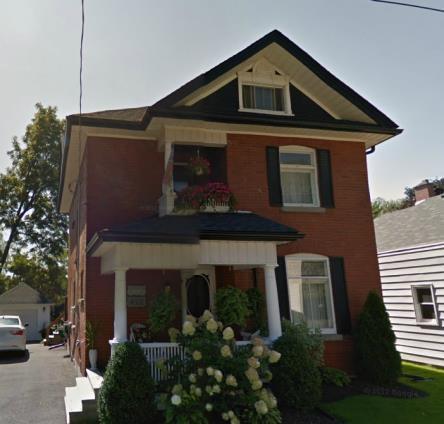 12 - Builder: Robert Howlett. - 2 1/2 storey house. - Brick veneer on concrete foundation. Clara Taylor 412 26 1911 Residential - 2-bay façade.