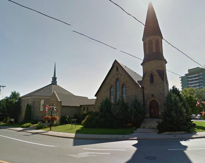 21 - Gothic Revival Style Church with more modern addition on east side. - 2 storey brick and concrete construction with yellow brick on a stone rubble foundation. - Steep gable roof St.