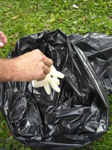 With the same gloves on, tidy up all possibly contaminated things, into waste bags. All uncontaminated equipment should already be in the tool box.