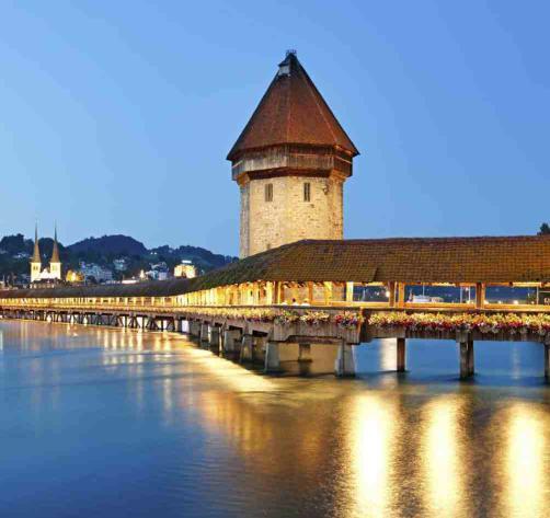 Visit the Lion Monument and the Kapell Brucke (wooden bridge). Take some time to shop for famous Swiss watches, knives, and chocolates. Enjoy a scenic cruise on the serene waters of Lake Lucerne.