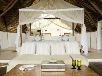 Guests can relax in individually decorated, open-air cottages each adorned with a four-poster bed, a lovely ensuite bathroom and a private veranda offering sweeping vistas