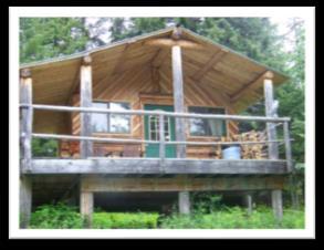 This cabin has no electricity, and no kitchen; features a large wood stove suitable for heating your hot water for coffee or tea. Sleeps 5/6 with a queen futon, double bed, and three twin beds.