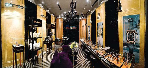 The interior design of the boutique is dominated by black, orange and gold color tones that render