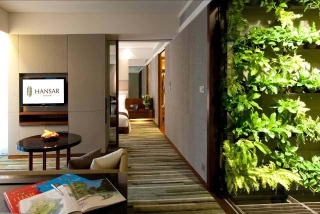Edge Suites (77sqm) feature an interior garden wall alive with tropical greenery at the