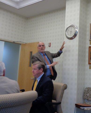 City Administrator Mike Herring took the clock off the wall and moved it one-minute forward, causing Mayor Bob