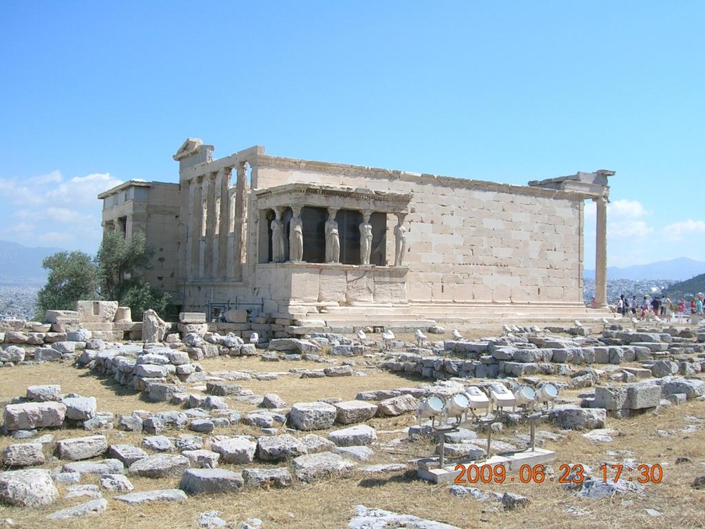 Erechtheion, Acropolis, Athens Photo Gillian Shepherd Then there is the building called the Erechtheion; in front of the entrance is an altar of Zeus the highest, where they sacrifice nothing that
