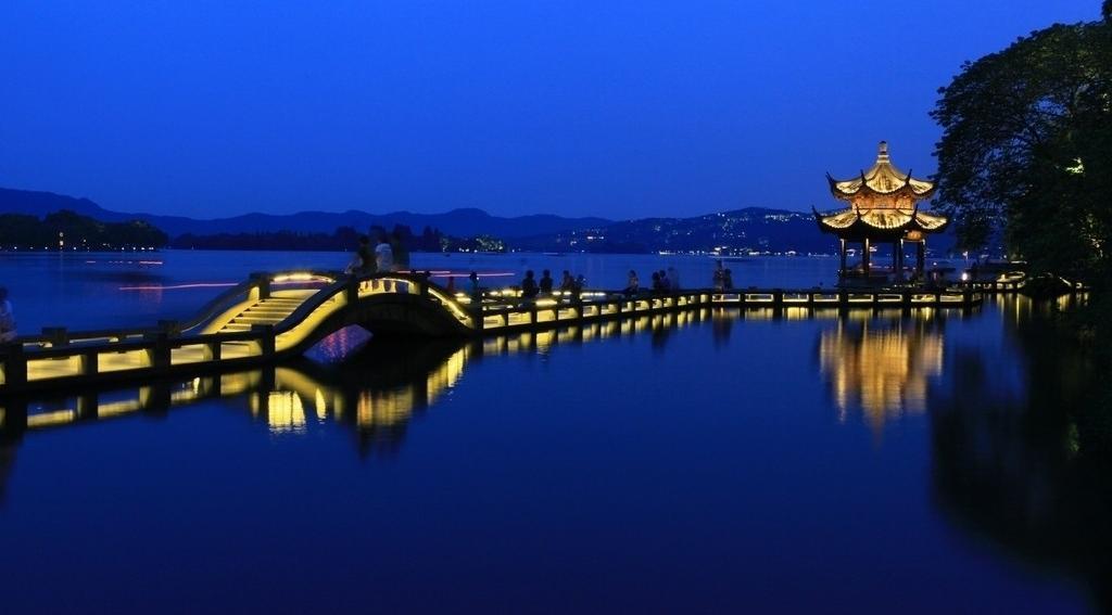 small bridges over the flowing steam. Attractions include Humble Administrator's Garden (Zhuozheng Yuan), Hanshan Temple (Cold Mountain Temple), Pan Gate.