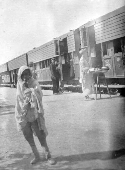 vendors at Indian railway station (early 20 th century) I was eighteen, visiting my grandmother, and the night train stopped at Deoli. A girl came down the platform, selling baskets.