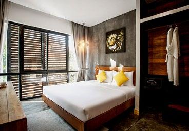 The Serenity Deluxe Double hotel rooms all have an eye-pleasing design concept that combines smooth concrete and dark wood.