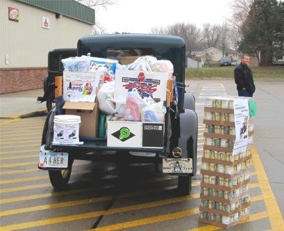 We collected enough food, paper products and detergent to fill Doug Heeren s pickup, Bob McKinney s huckster and enough left over to put in Howard Denker s pickup.