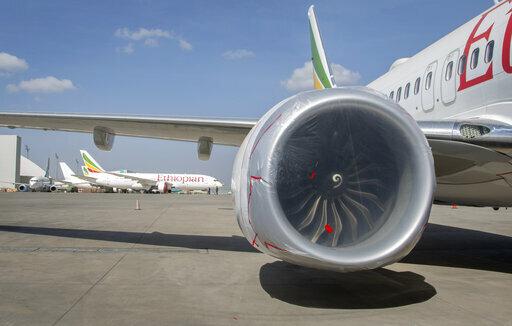Other Ethiopian Airlines aircraft are seen in the distance behind an Ethiopian Airlines Boeing