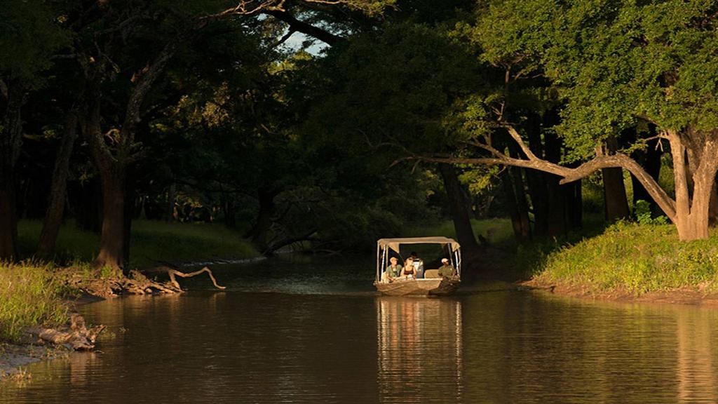 exhilarating boat safari. Travelling out of season and combining the rustic feel of Kakuli with the colonial splendour of Chinzombo, you ll enjoy two superb camps at a fraction of the cost.