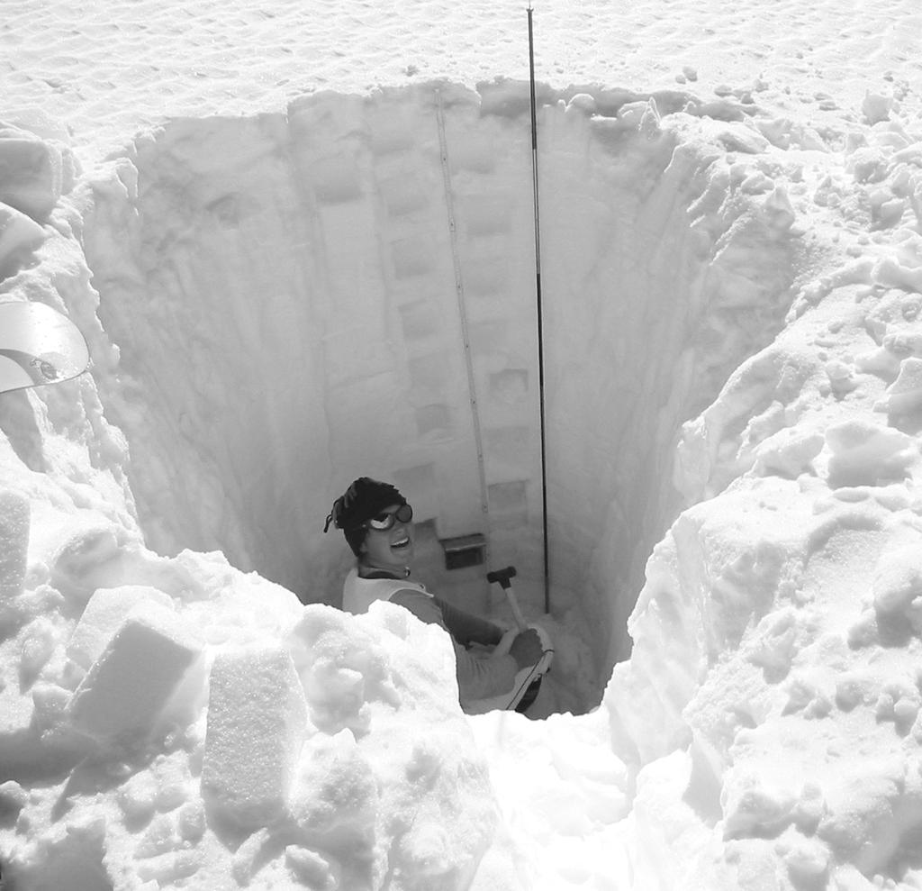 This is called a steady-state glacier. Figure 1.3: Left: Two stakes drilled into the glacier and in the background an automatic weather station. Right: Measuring snow density in a snow pit.
