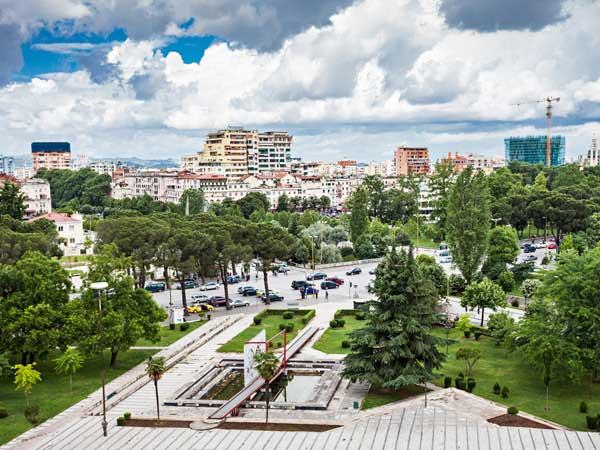 Tirana, Albania, with Kosovo FROM $949 PER PERSON 4 DAYS $237 PER DAY At the end of the Communist era, Albania's compact capital Tirana blossomed into a cheerful city of parks, fountains, and cafés.