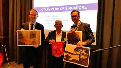 Rtn Horst Hagemann (right) called on members to raise a toast to the 3 Swiss Clubs